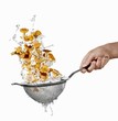 Washing chanterelles in a colander