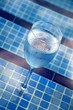 A glass of water by the pool