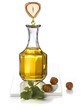 Hazel nut oil dropping from a hazel nut into a carafe