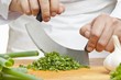 Chopping curly parsley with a mezzaluna knife