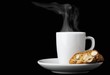 Biscotti (Italian almond biscuits) and a cup of espresso against a black background
