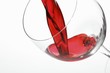 Red wine being poured into a glass