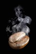 A freshly roasted coffee bean with steam