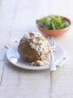 A baked potato with cottage cheese