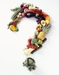 Fresh Fruit and Veggies Forming a Question Mark on a White Background