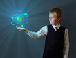 Foto: schoolboy holding glowing atom schoolboy holding glowing atom