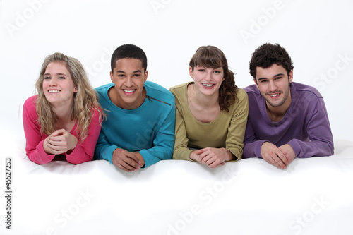 Photo: Found young adults laying down together Found young adults laying down together