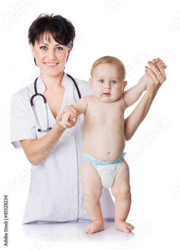 Photo: beautiful doctor and baby on a white background. beautiful doctor and baby on a white background.