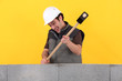 Construction worker destroying his work.