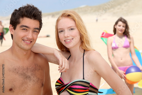 Photo: Young couple at the beach Young couple at the beach