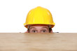 Man in a hardhat hiding