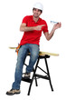 portrait of high-spirited carpenter showing protective goggles