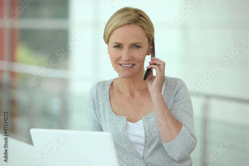 Photo: portrait of a woman on the phone portrait of a woman on the phone