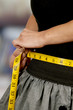 Woman Measuring Her Waist