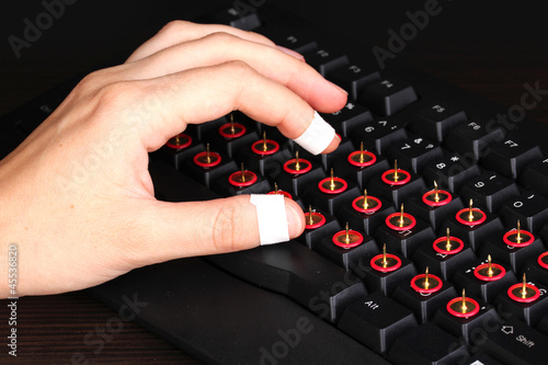 Photo: Painful typing on keyboard close-up Painful typing on keyboard close-up