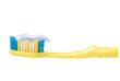 Yellow toothbrush coated with a toothpaste