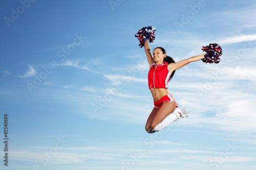Photo: Young female cheerleader Young female cheerleader