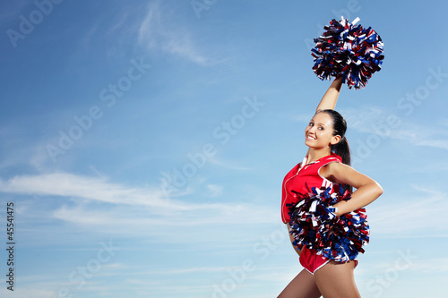 Photo: Young female cheerleader Young female cheerleader