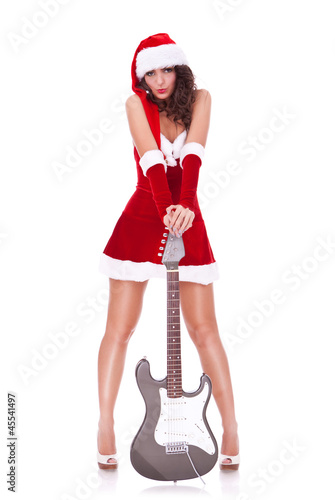 Photo: sexy young santa woman with guitar sexy young santa woman with guitar