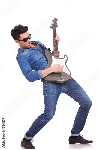 Photo: young guitarist performing young guitarist performing