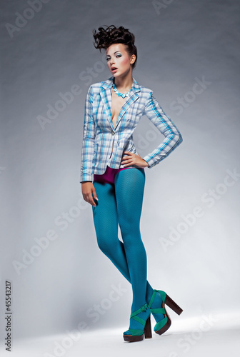 Photo: Fashion style - beauty trendy woman in leggings posing Fashion style - beauty trendy woman in leggings posing
