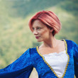Photo: Red hair woman portrait with vintage blue dress. Red hair woman portrait with vintage blue dress.