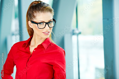 Photo: Portrait of a young confident business woman smiling Portrait of a young confident business woman smiling