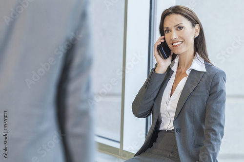 Photo: Woman or Businesswoman Using Cell Phone Woman or Businesswoman Using Cell Phone