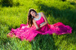 Foto: Woman in a long pink dress Woman in a long pink dress