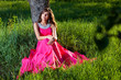 Foto: Woman in a long pink dress Woman in a long pink dress