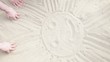 Hands draw a sun