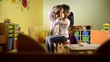People and fun, teacher playing with little girl at school