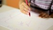 Babies and fun, two happy children drawing at school