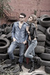 Sexy and fashionable couple wearing jeans, grungy location