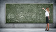 Business person against the blackboard