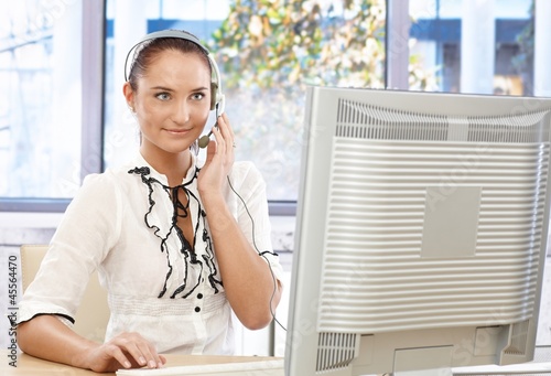Photo: Attractive customer service representative Attractive customer service representative