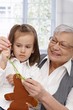 Grandmother and granddaughter sewing