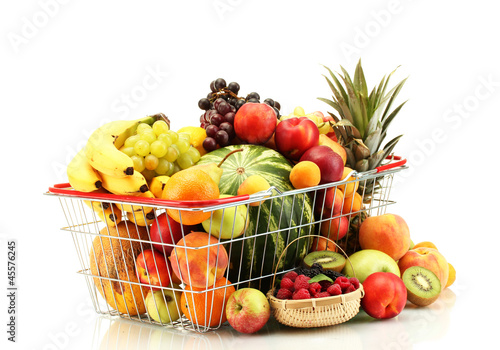 Photo: Assortment of exotic fruits in metal basket isolated on white Assortment of exotic fruits in metal basket isolated on white
