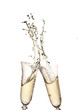 Photo: Pair of champagne flutes making a Champagne splash Pair of champagne flutes making a Champagne splash
