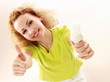 A young girl with an energy-saving bulb