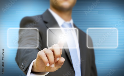 Photo: Businessman touching digital screen Businessman touching digital screen