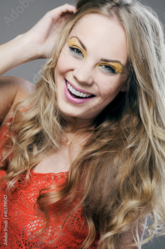 Photo: Blonde girl with long curly hair. Blonde girl with long curly hair.