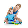 Photo: baby boy and mother playing together with construction set toy baby boy and mother playing together with construction set toy