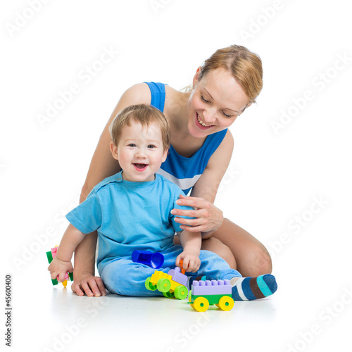 Photo: baby boy and mother playing together with construction set toy baby boy and mother playing together with construction set toy