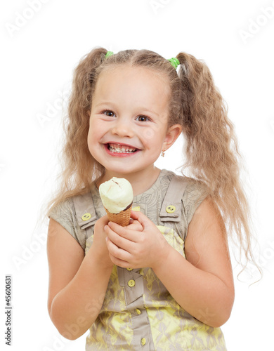 Photo: little curly girl eating ice cream in studio isolated little curly girl eating ice cream in studio isolated