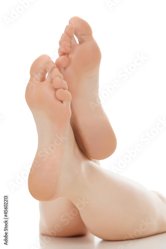 Photo: Woman feet over white Woman feet over white