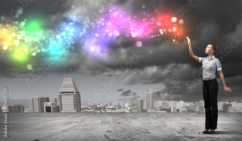 Photo: Businessman with colourful light beam in his hands Businessman with colourful light beam in his hands