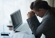Stressed business woman working sitting at desk in hotel room