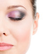Photo: Close up of woman's half face with closed eye with makeup Close up of woman's half face with closed eye with makeup