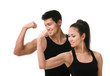 Photo: Two sportive people in black sportswear showing their biceps Two sportive people in black sportswear showing their biceps